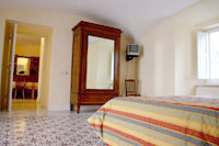 Apartment in Sorrento: Wardrobe and TV in the bedroom of Armida Apartment in Sorrento