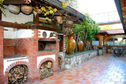 Courtyard with oven, table and chairs