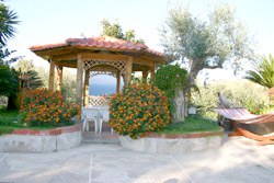 Apartment in Sorrento: Gazebo  with table and chairs with a magnificent sea-view