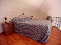 Flat in Positano: The mezzanine level with the double bed of Ludovica Type D Flat in Positano