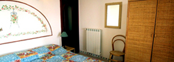Apartment on Amalfi Coast: Detail of the bed and the wardrobe in the bed-room of Vicalvano Type A Apartment along the Amalfi Coast