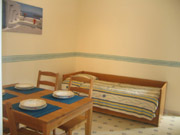 Dining area with the convenient location of a single bed