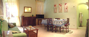 Rome Accommodation: Living-room with dining table of Tritone Type B Accommodation in Rome