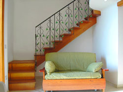 Flat in Positano: Sofa-bed and the staircase of Ludovica Flat Type D in Positano